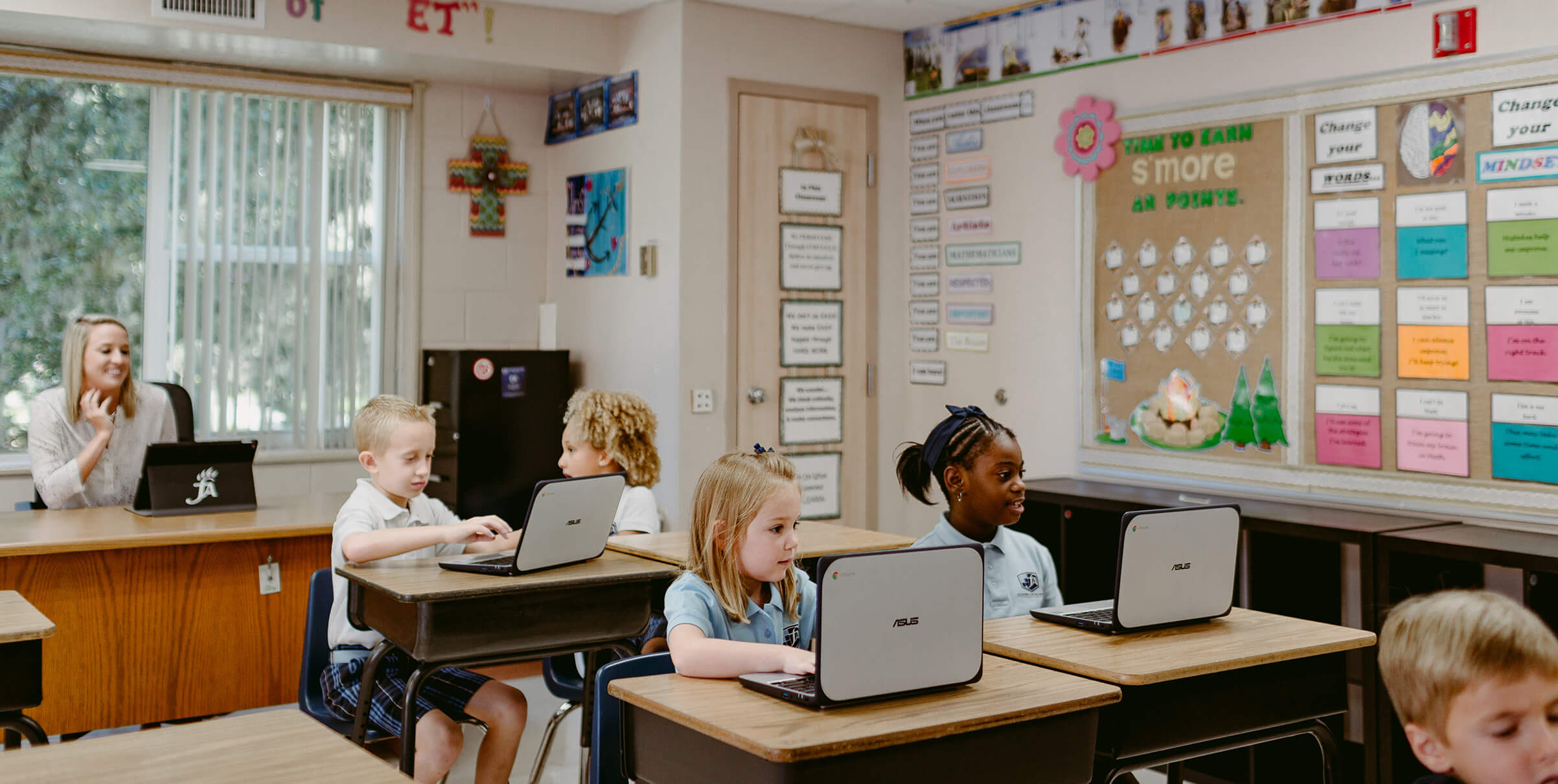 Kids in classroom using computers