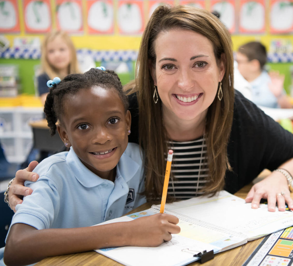 Teacher and kid smiling